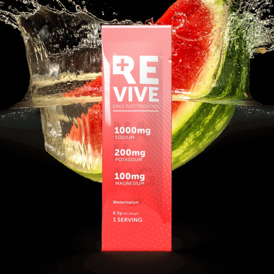 Revive Daily Electrolytes Raspberry single sachet with raspberries splashing in water